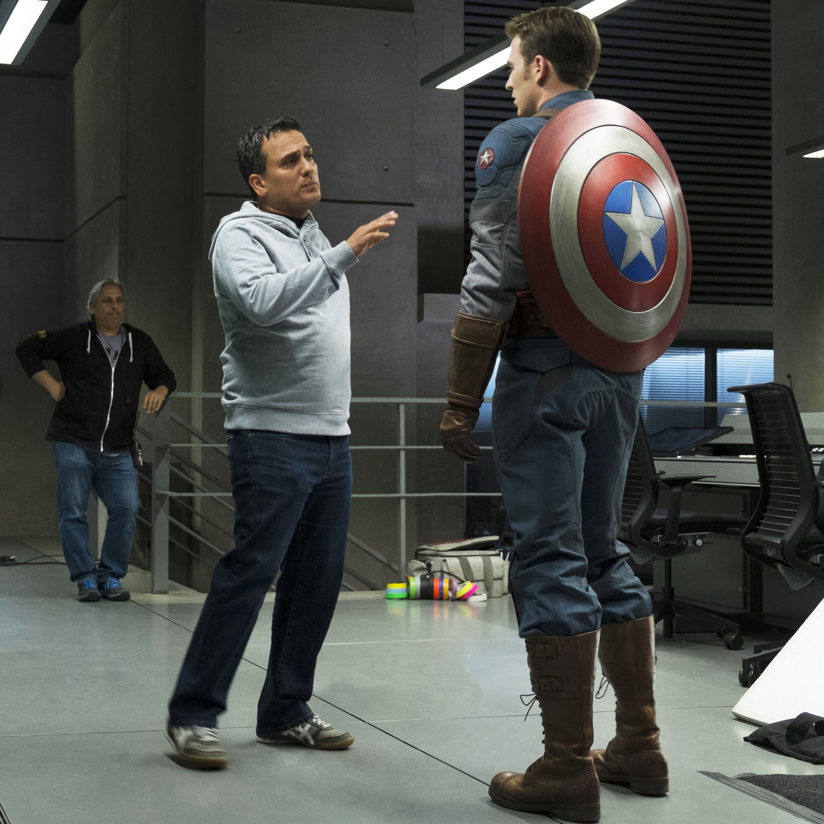 Joe Russo and Chris Evans standing on the set of Captain America: The Winter Soldier