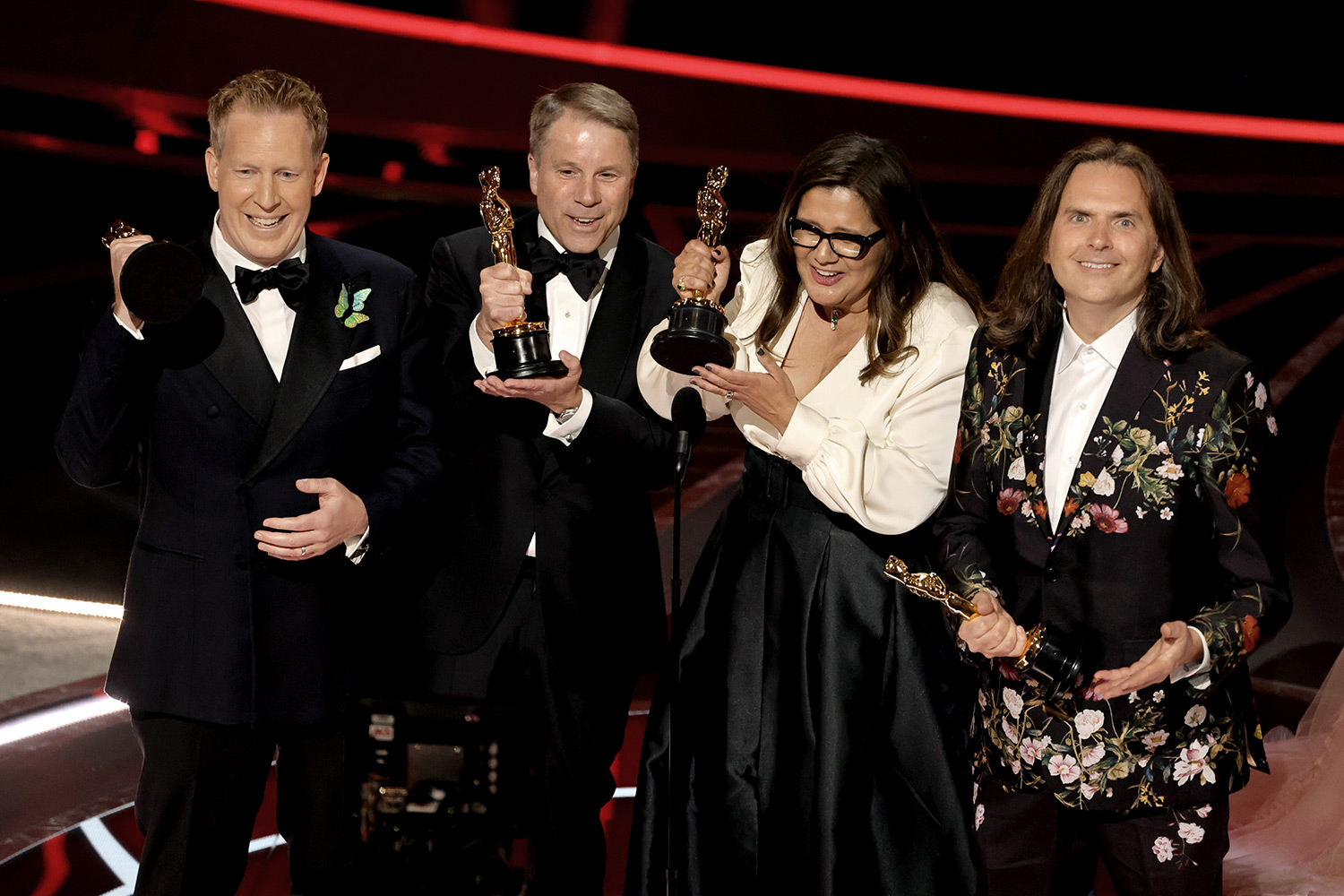 Byron Howard, Jared Bush, Yvett Merino & Clark Spencer accepting their award at the Oscars 2022 for Encanto