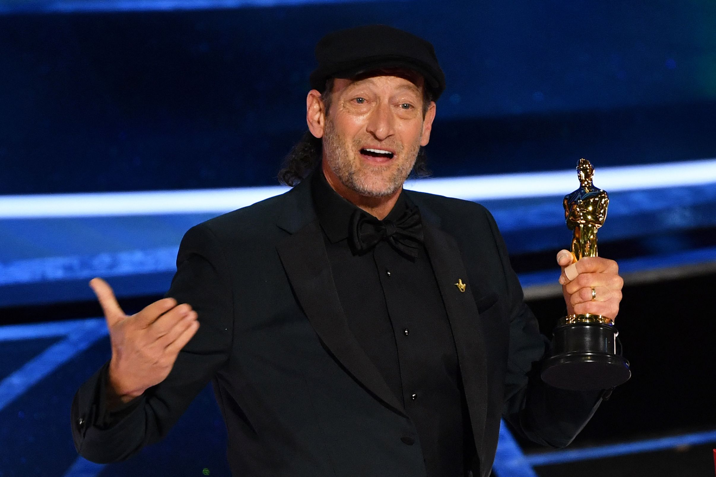 Troy Kotsur accepting his award at the Oscars 2022 for CODA